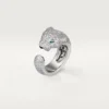 Bague Panthère de Cartier – Or blanc, diamants, émeraudes, onyx – Cartier