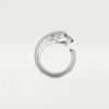 Bague Panthère de Cartier – Or blanc, grenats tsavorites, onyx – Cartier