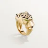 Bague Panthère de Cartier – Or jaune, laque, grenat tsavorite, onyx – Cartier