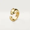 Bague Panthère de Cartier – Or jaune, onyx, grenat tsavorite – Cartier