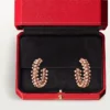 Boucles d&rsquo;oreilles créoles Clash de Cartier – Or rose, petit modèle | Cartier US