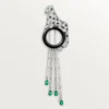 Broche Panthère de Cartier – Or blanc, émeraudes, onyx, diamants – Cartier