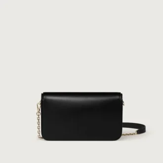Mini sac à chaîne, Double C de Cartier – Cuir de veau noir, finition en or et émail noir – Cartier