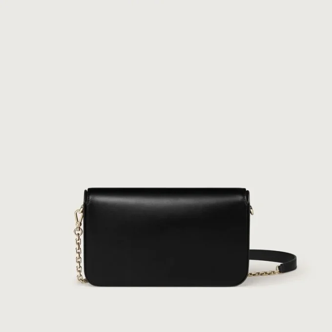 Mini sac à chaîne, Double C de Cartier – Cuir de veau noir, finition en or et émail noir – Cartier Mini sac à chaîne, Double C de Cartier – Cuir de veau noir, finition en or et émail noir – Cartier
