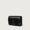 Mini sac à chaîne, Double C de Cartier – Cuir de veau noir, finition en or et émail noir – Cartier Mini sac à chaîne, Double C de Cartier – Cuir de veau noir, finition en or et émail noir – Cartier