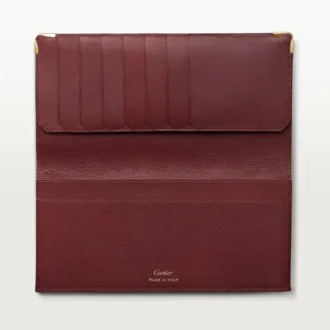 Portefeuille international à soufflets, Must de Cartier – Cuir de veau bordeaux, finition dorée – Cartier