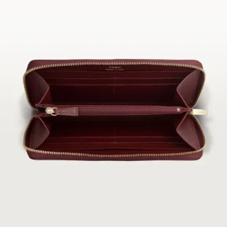 Portefeuille international zippé, Must De Cartier – Cuir de veau bordeaux, finition dorée – Cartier
