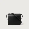 Sac à bandoulière, Mini, Double C de Cartier – Cuir de veau noir, finition en or et émail noir – Cartier Sac à bandoulière, Mini, Double C de Cartier – Cuir de veau noir, finition en or et émail noir – Cartier