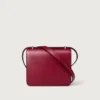 Sac à bandoulière, Mini, Double C de Cartier – Cuir de veau rouge cerise, finition en or et émail rouge cerise – Cartier Sac à bandoulière, Mini, Double C de Cartier – Cuir de veau rouge cerise, finition en or et émail rouge cerise – Cartier
